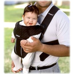 A man with a baby in a baby carrier